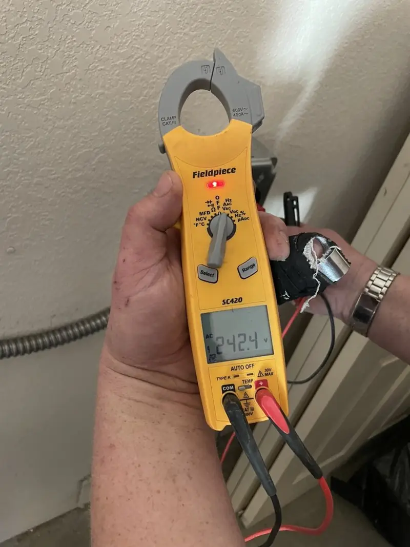 Voltage testing with clamp meter during Generator Installation in Whitman